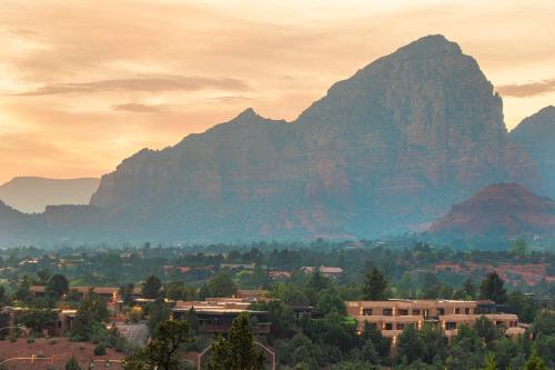 a view of a city with mountains in the background at Sky Rock Sedona, a Tribute Portfolio Hotel in Sedona