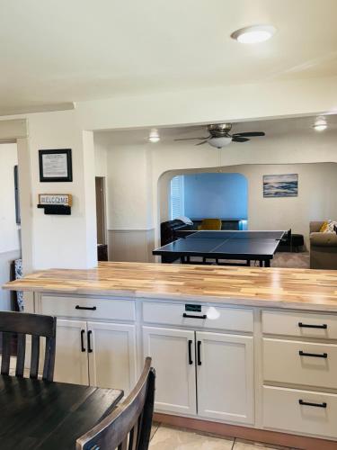 a kitchen with a large wooden counter top in a room at Charming Modernized Farmhouse in Moxee City
