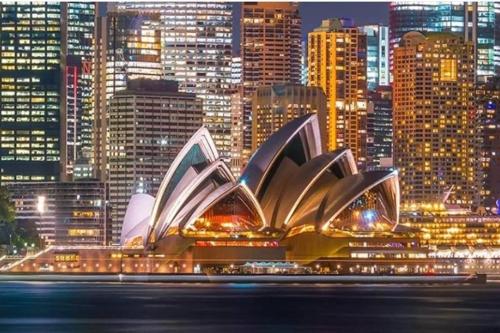a view of the sydney opera house at night at Standard Queen Room in Gregory Hills - Quaint Spot - Shared Bathroom in Gledswood Hills