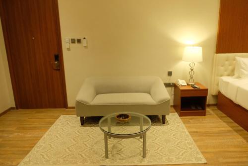 a living room with a couch and a coffee table at Villa Isabel Hotel in Sorsogon