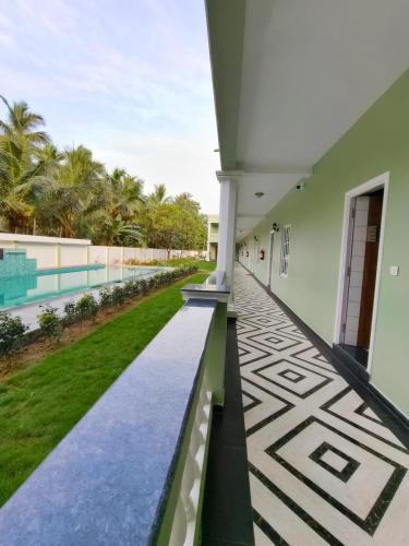 a view from the balcony of a house with a swimming pool at Le French Nest in Puducherry