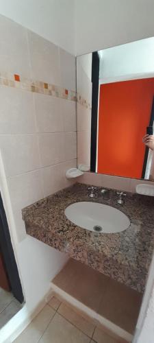 a bathroom with a sink and a mirror at La Reserva in Los Altos
