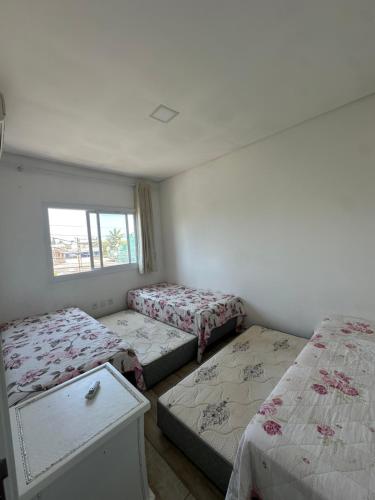 Katil atau katil-katil dalam bilik di Casa com Piscina em Xangri-Lá RS