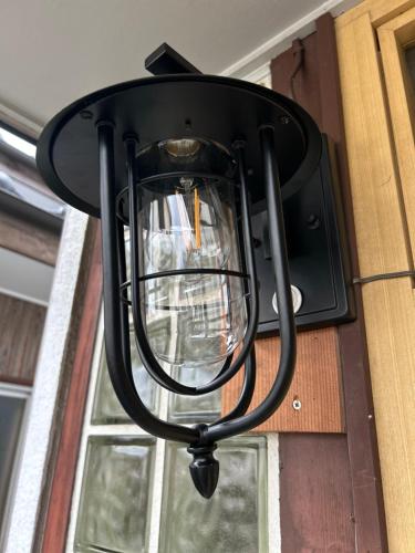 a light hanging on the side of a building at ポートサイドSasebo藤原町 in Sasebo