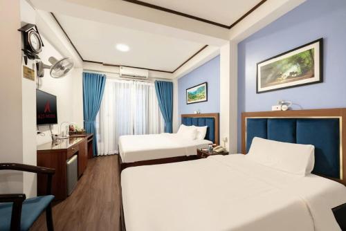 Postel nebo postele na pokoji v ubytování A25 Hotel - 26 Hàng Nón
