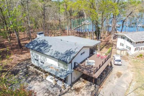 an overhead view of a house with a porch at Lake Lanier, Lakefront, Boating, Hot Tube, Games, Luxury, Family, Friends, Hiking, Fishing and Birdwatching in Flowery Branch