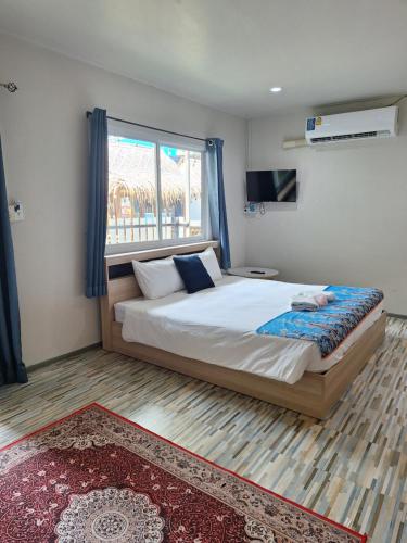 Postel nebo postele na pokoji v ubytování Lalisa Hotel Aonang