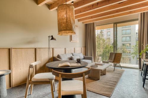 a living room with a table and a couch at ONTO Alvaro Obregon Mexico City in Mexico City