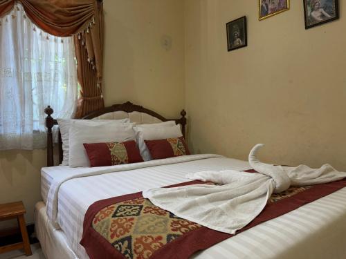 Postel nebo postele na pokoji v ubytování Restu Guest House