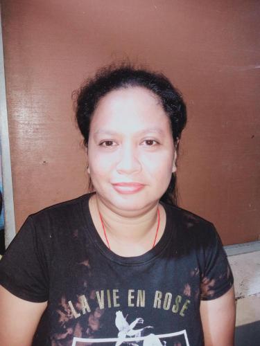 a woman in a black shirt is posing for a picture at Asia Star hotel in Guinsorongan