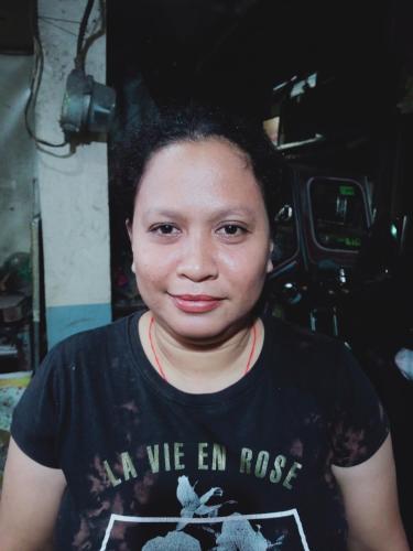 a woman wearing a shirt that says all we en rose at Asia Star hotel in Guinsorongan