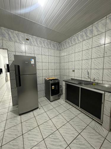 Kuchyň nebo kuchyňský kout v ubytování Primeiro andar charmoso