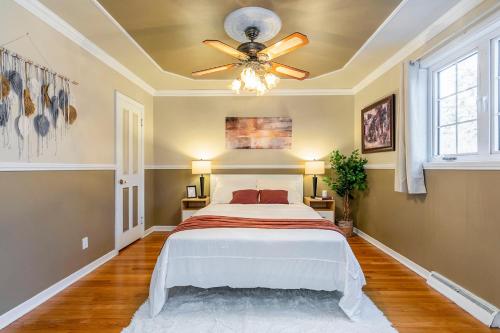 a bedroom with a bed and a ceiling fan at Cozy Montreal Entire Apartment-3min walk to Metro-free parking-Botanical garden-biodome in Montréal
