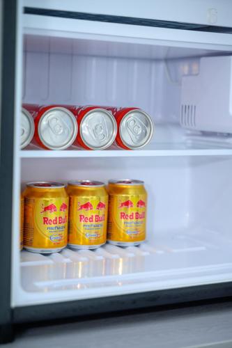 a refrigerator filled with cans of canned food at 6668 Hotel - Chi nhánh 1 in Tây Ninh