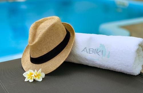a straw hat sitting next to a roll of toilet paper at Studio 21-Abiki Mauritius with Tourism Authority permit in Albion
