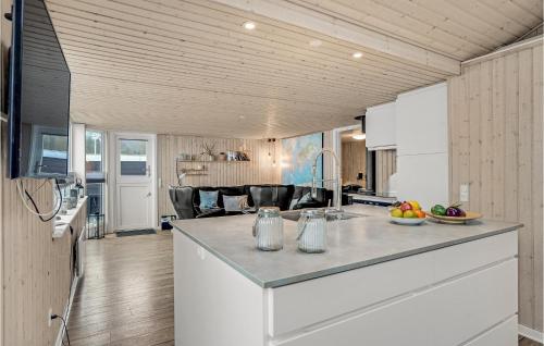 a kitchen with a large island in a room at Lovely Home In Haderslev With Wifi in Haderslev