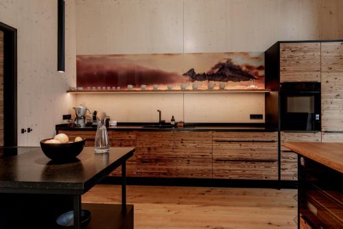 a kitchen with a table with a bowl of food on it at Alpenlodges in Schönau am Königssee