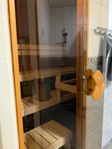 a bathroom with a sink and a toilet in a room at Cozy 2BR Apartment KA64 with sauna in Oulu