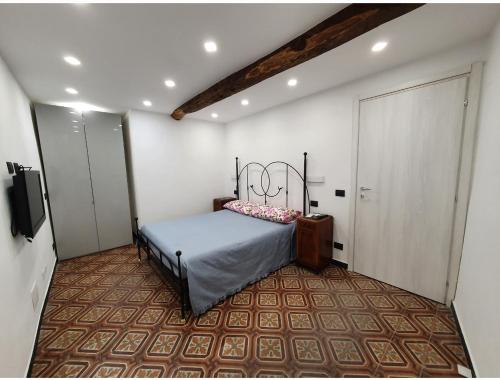 Ένα ή περισσότερα κρεβάτια σε δωμάτιο στο Casa nel borgo