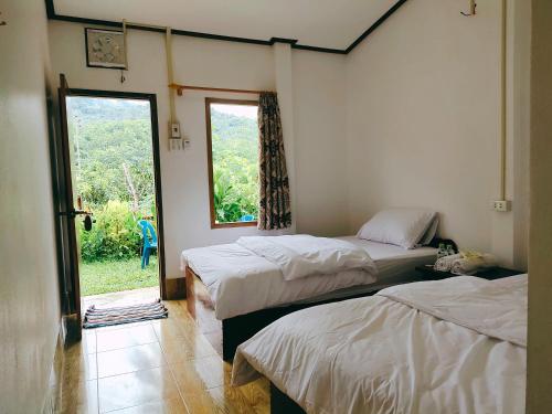 Ένα ή περισσότερα κρεβάτια σε δωμάτιο στο Meexok guesthouse