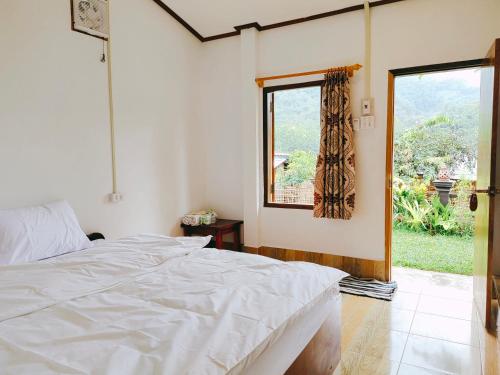 Ένα ή περισσότερα κρεβάτια σε δωμάτιο στο Meexok guesthouse