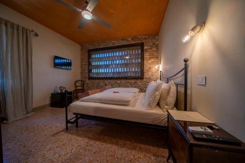 Postel nebo postele na pokoji v ubytování Agriturismo Podere Tovari