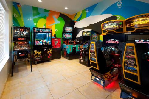 a room with many arcade games and video games at Fairfield Inn Suites by Marriott Orlando At SeaWorld in Orlando