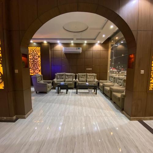 a waiting room with couches and chairs in a building at بانوراما لشقق المخدومة in Dammam