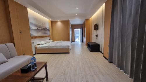 a hotel room with a bed and a couch at Hoongthip hotel in Savannakhet