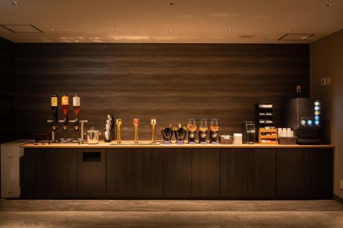 a bar with several bottles of alcohol on a counter at TAOYA Shirahama Senjyo in Shirahama