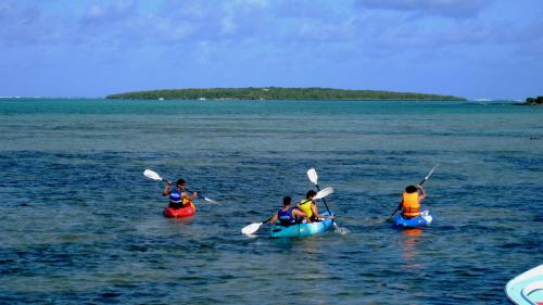 a group of people in kayaks in the water at Coco Villa in Mahébourg