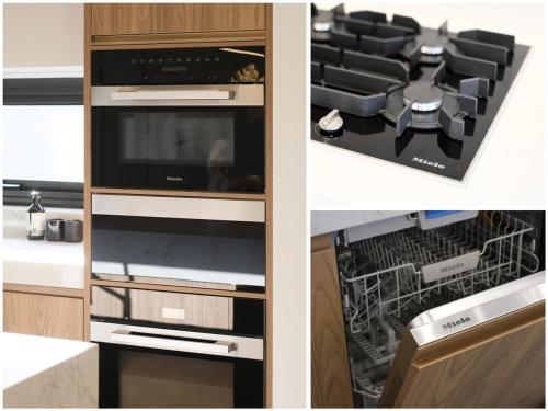 a kitchen with a stove and a dishwasher at Family-friendly entire Lux 4BR Home 2 parking in Miranda