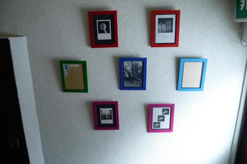 a wall with a bunch of pictures on it at Kogakuro in Myoko