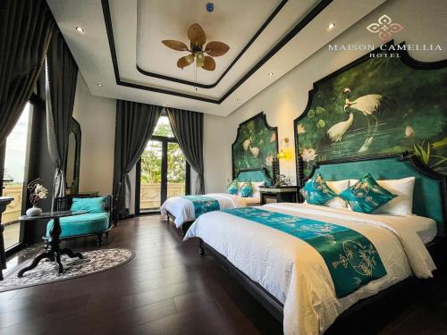 Voodi või voodid majutusasutuse MAISON CAMELLIA Hotel toas