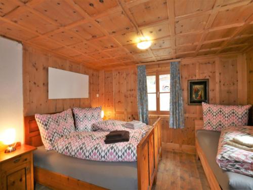 a bedroom with a couch and a bed in a room at Farmhouse in Tobadill with Mountain Views in Tobadill