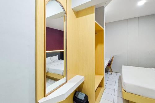 Hotel Ciputat RedPartnerにあるベッド