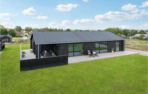 a black house with a black roof at 3 Bedroom Stunning Home In Haderslev in Haderslev