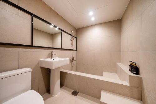 a bathroom with a sink and a toilet at Jamsil Stay 509 in Seoul