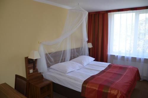 En eller flere senge i et værelse på Obiekt Tatar - Usługi Hotelarskie