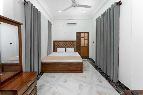 a bedroom with a bed in a room at Amith Villa in Aluthgama