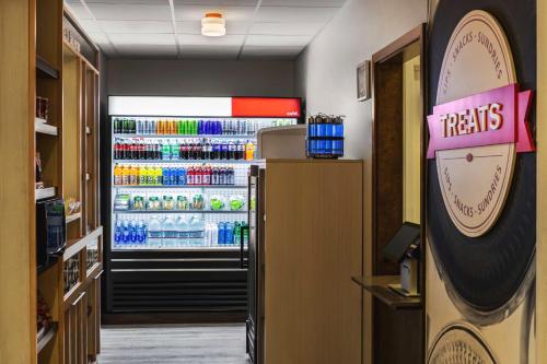 a store with a refrigerator with drinks in it at Hampton Inn Tropicana in Las Vegas