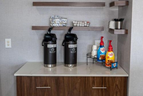 two water bottles on a counter in a kitchen at La Quinta by Wyndham Dallas Mesquite in Mesquite