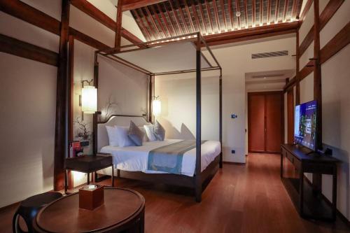 Yuyao Yangmingguan Hotelにあるベッド