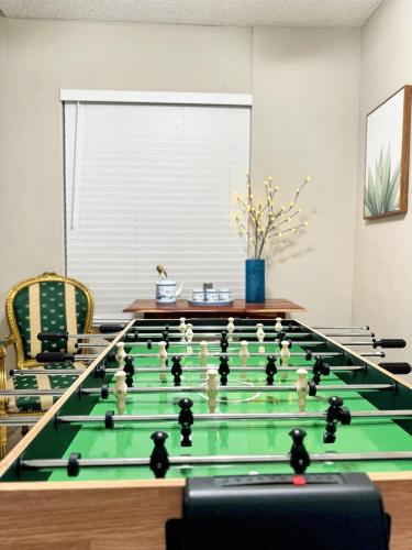 a room with a table with a pool game at Modern & Spacious Family and Friend 4B3B House in Moreno Valley
