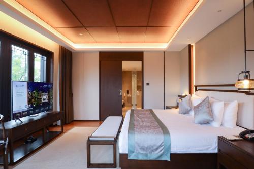 Yuyao Yangmingguan Hotelにあるベッド
