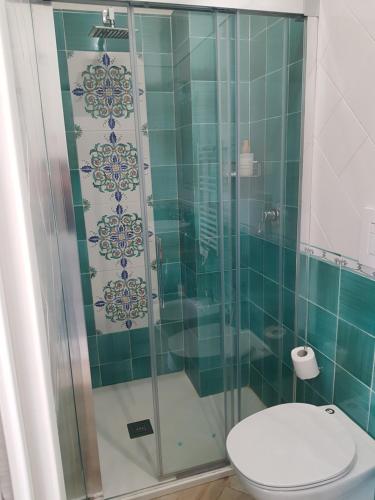 a bathroom with a glass shower with a toilet at B&B DieMme Amalfi Coast in Vietri sul Mare
