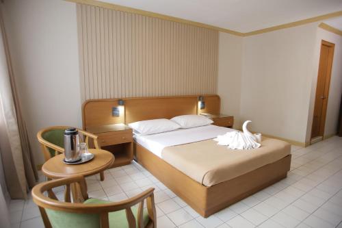 Postel nebo postele na pokoji v ubytování Hotel Soriente