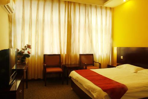 Huangshan Tangkou Haoshi International Youth Hostelにあるベッド