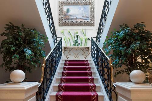 a row of stairs leading up to a balcony at Royal Manotel in Geneva