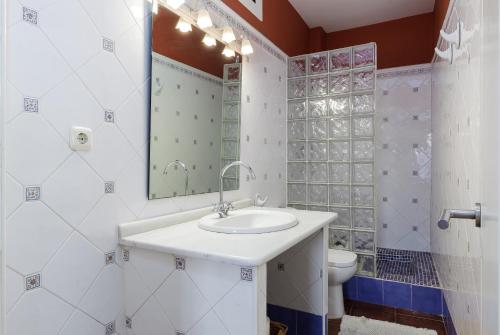 a bathroom with a sink and a toilet at Dream Vacation at Casa Vicki in Almería